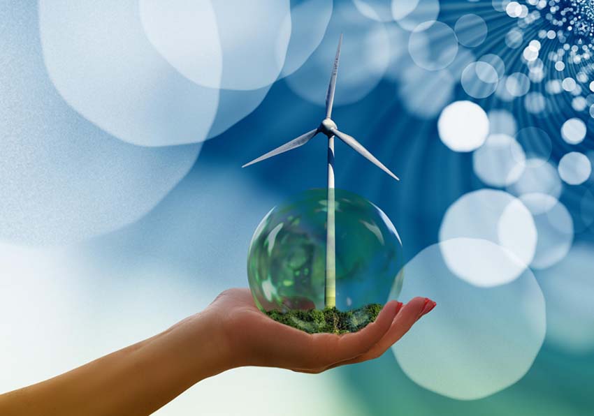 A hand, a terrarium ball and the blades of a windmill
